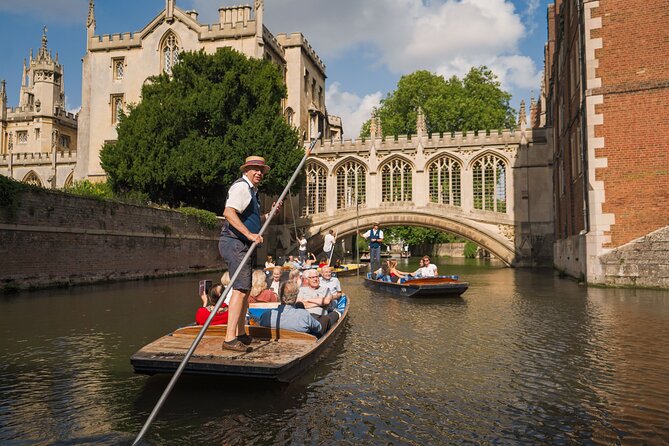 Families punting on the River Cam beneath the Bridge of Sighs in Cambridge