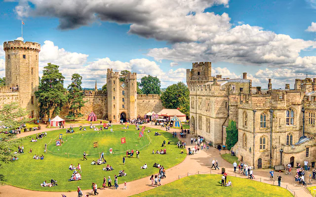 Warwick Castle with families outside